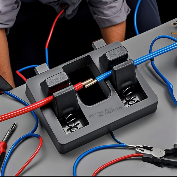 Electrical testing equipment with red and blue wires on a gray surface